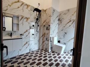 a bathroom with a toilet and a sink at Calvian Villa in Walliwala East +18 photos