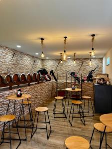a room with tables and chairs and a brick wall at Sandoco - Golf - Pickleball - Beach Volleyball & Pool - All Exclusive in Ponte de Lima +45 photos
