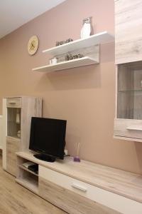 A television and/or entertainment centre at BB Apartman