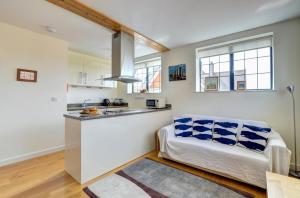 a kitchen with a counter and a couch in a room at 2 Bed in Swanage oc-wy412 in Swanage