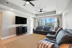 a living room with a couch and a flat screen tv at New 2 Bed 2 Bath Condo with Pool at BMS in Bristol