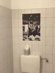 a picture of a boy on top of a toilet in a bathroom at Helpens Hof in Salzhausen +56 photos