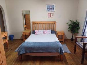 a bedroom with a bed with two pillows on it at Gouritsmond Self Catering Units in Gouritzmond