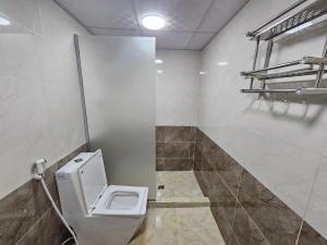 a bathroom with a toilet in a room at Lawrence Luxury Camp in Wadi Rum