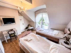 a bedroom with two beds and a window at Zielone Zacisze in Murzynowo Kościelne +267 photos
