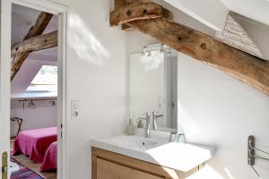 a bathroom with a sink and a mirror at Maison Chalendeix in Nedde +117 photos