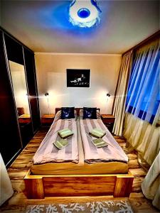 a bedroom with a large bed in a room at Borovets luxury studio in Samokov
