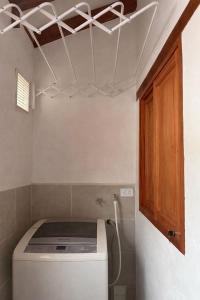 a washing machine in a kitchen with a ceiling at Boutique La Gloria in Villa de Leyva