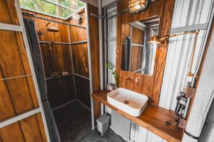 a bathroom with a sink and a shower at Shiva Lodge in Ko Tao