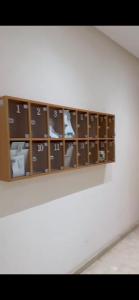 a shelf with many objects in it on a wall at Diamonds in Rabat
