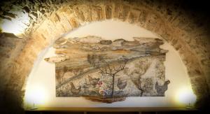 a mural on the wall of a building with chickens at DONNAPAOLA MODERN FARM in Altamura