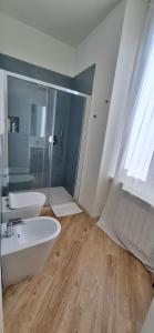 a bathroom with a white sink and a shower at Casa Mafalda in Torre Boldone
