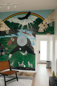a wall with a mural of a river and a bird at Outbounder in Bayfield +35 photos