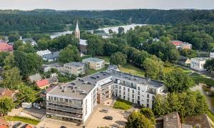 an aerial view of a city with a large building at Birštono Terasos in Birštonas