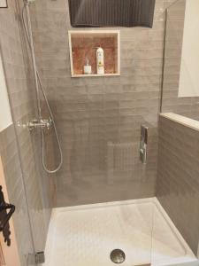 a bathroom with a shower with a tub and a shower at Suite Duquesa de Parcent in Ronda +14 photos