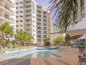 an image of a swimming pool in front of a building at Mantra Trilogy in Cairns