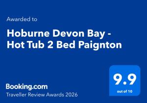 a blue sign with the textoitline devon bay hot tub bed pillow at Hoburne Devon Bay - Hot Tub 2 Bed Paignton in Paignton