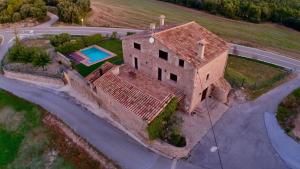 an aerial view of a house with a swimming pool at Cal Fortic, Navès in Navés