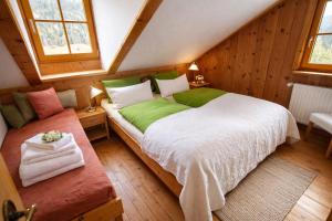a bedroom with a large bed in a attic at Chalet Steiermark in Pusterwald