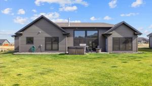 a house with a green lawn in front of it at Paradise View in Red Lodge +47 photos