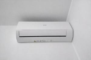 a white printer sitting on top of a white wall at Golden Stay Rome - Golden Room - Close to Metro C in Tor Vergata