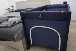 a bed with a blue bed frame in a room at Golden Stay Rome - Golden Room - Close to Metro C in Tor Vergata +11 photos
