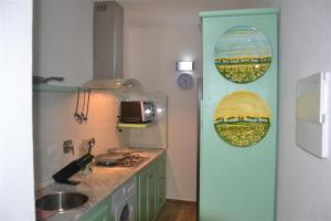 a kitchen with a sink and a counter top at Casa Tirli in Tirli