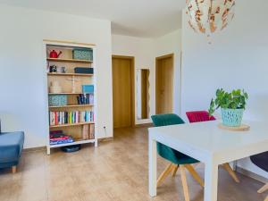 a dining room with a white table and chairs at Ferienwohnung in Neudenau +1 photo