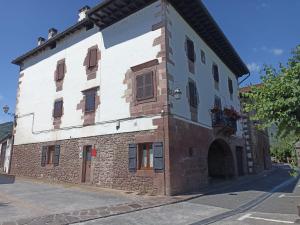 an old stone building with aventh floor at TXARRENEA in Elizondo