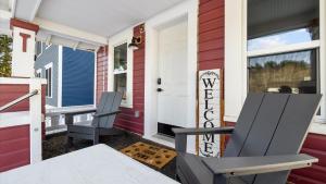 a house with two chairs on the front porch at Rio Ridge in Red Lodge