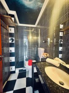 a bathroom with a sink and a toilet in it at Captain's Log House in Baleal +63 photos