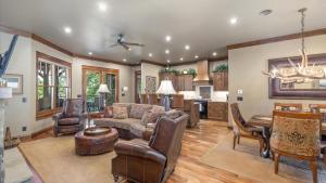 a living room with a couch and a table at Rock Creek Escape in Red Lodge
