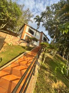 a set of steps leading up to a house at Hacienda Torcoroma in Bucaramanga