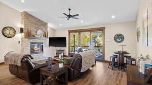 a living room with a couch and a fireplace at Willow Creek Hideaway in Red Lodge