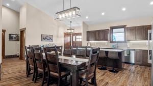 a kitchen with a table and chairs and a counter at Willow Creek Hideaway in Red Lodge +68 photos