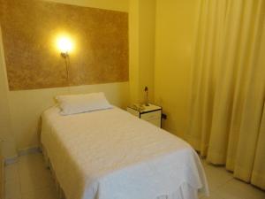 Voodi või voodid majutusasutuse HOTEL MAISON FIORI (Centro) toas