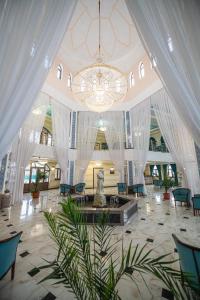 a large lobby with a chandelier in a building at KHIVA RESIDENCE - Eastern Hotel in Khiva