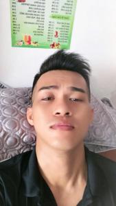 a young man is laying on a bed at Spa Ý Phát in Ấp Yên Thượng