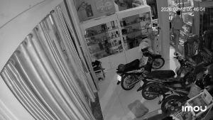 a room with two motorcycles parked in a store at Spa Ý Phát in Ấp Yên Thượng