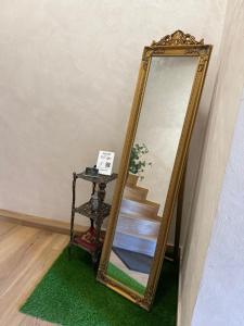 a mirror sitting on a floor next to a staircase at Just a Dream - guest apartments in Troyan +116 photos