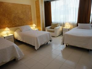 Voodi või voodid majutusasutuse HOTEL MAISON FIORI (Centro) toas