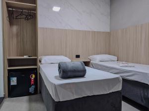 a hospital room with two beds at Hotel Pousadas Club Centro in Sorocaba