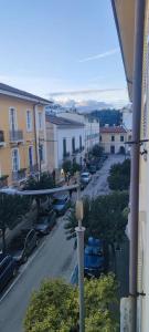 a view of a city street with cars parked at The Reggia Nest in Caserta