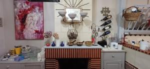 a room with a counter with vases on it at Ideal pour une pause in Saint-Georges-sur-Cher