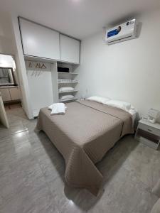 a bedroom with a bed in a white room at Alojamiento Agua Termal en Federacion Entre Rios in Federación +17 photos
