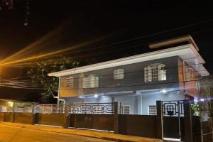 a house at night with lights in front of it at Rest a While in San Juan