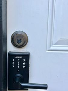a door with a key card in front of a door at Morse Cottage in Houston