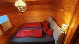 a room with two beds in a sauna at Holzhaus direkt am See in Priepert +9 photos