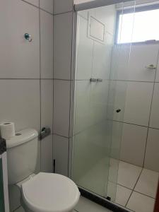 a bathroom with a shower and a toilet at AP Evangelista in Caruaru +8 photos