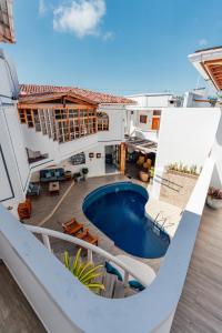a view of a house with a swimming pool at Hotel Santa Fe in Puerto Ayora
